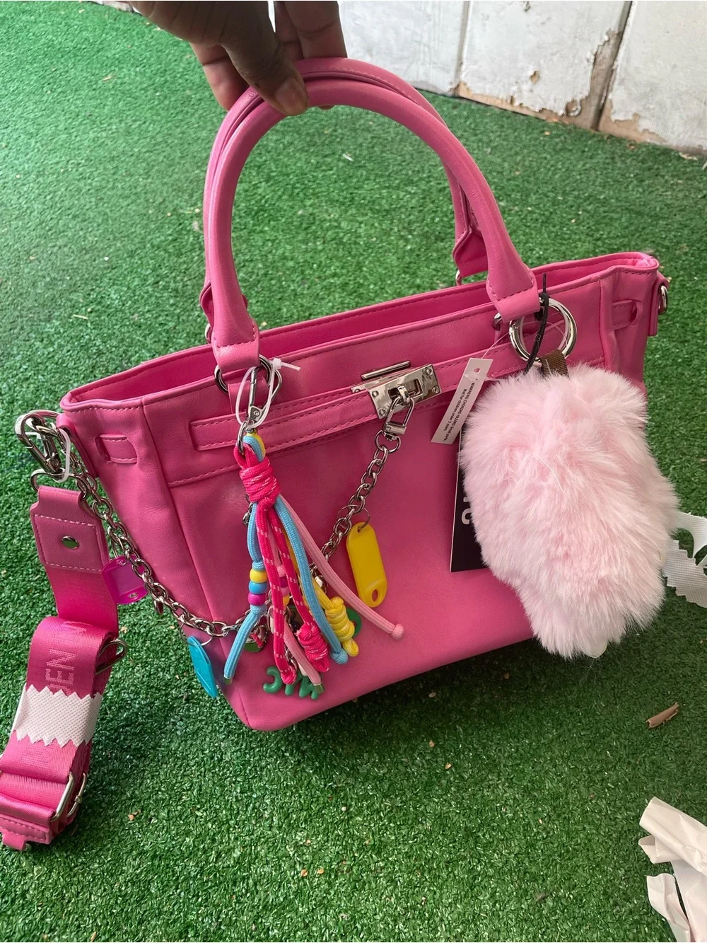 Pink Madden NYC satchelhandbag with plus charm